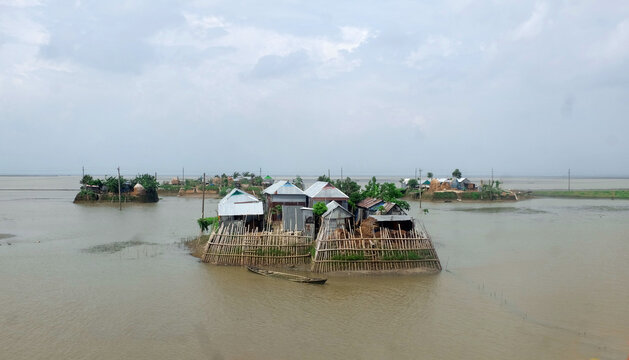 During the monsoon, the low-lying areas of Bangladesh are submerged under water. Meanwhile, the house is submerged in water around the house