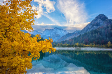 Jasna lake in Triglav national park, Kranjska Gora, Slovenia, autumn landscape. Scenic view of a clear water with reflection and stunning rocky Alps mountains, outdoor travel background
