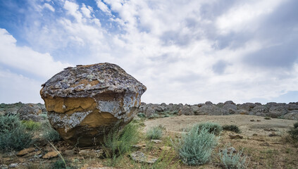 Unusual spherical shape of stones in the Kazakh steppe Mangistau, valley of balls in nature Torysh