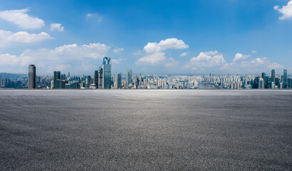 Asphalt road square and city skyline with modern buildings