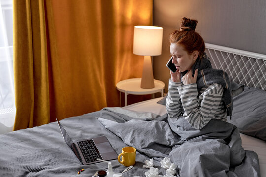 Bad feeling woman lying on bed with phone, calling doctor, ambulance, ginger girl making phone call to friend asking to bring medicine conversation chat talk with family closeup side view portrait