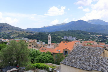 View over Corte city in Corsica surrounded by mountains, France