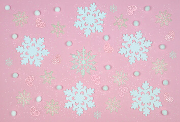 pink winter festive background with snowflakes ,hearts, sparkles .top view.,flat lay.