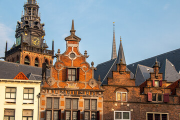 Fototapeta premium Nijmegen, the Netherlands. June 18th 2023. The buildings of the old city centre on a market square at sunrise.