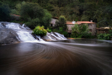 Waterfall and watermills of Barosa. Barro, Galicia, Spain.