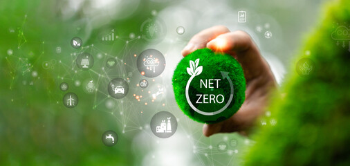Net zero icon and carbon neutral concept in the hand for net zero greenhouse gas emissions target...