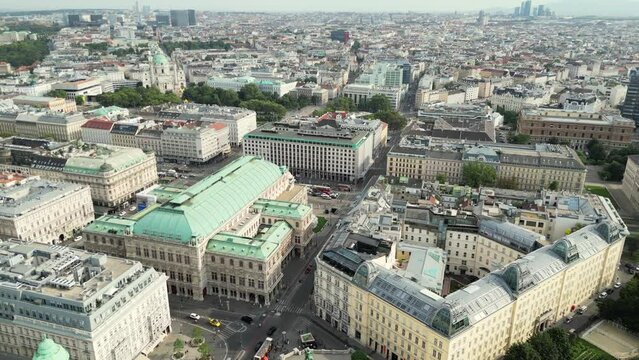 Beautiful view of Wiener Staatsoper (Vienna State Opera) in aerial view of Vienna, capital city of Austria. Top view baroque architecture with red rooftops with drone of historical capital city Vienna