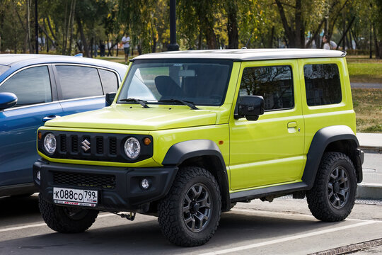 Suzuki Jimny four-wheel drive off-road mini SUV car parked on street