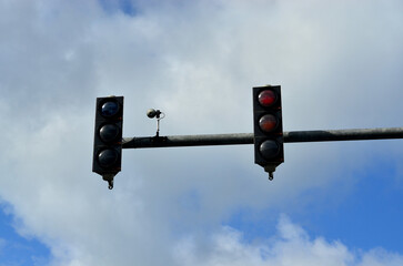 A traffic light hangs on a pole in Europe