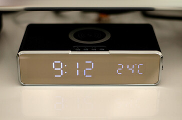Electronic alarm clock in home interior