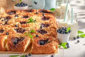 Delicious blueberry yeast cake with crumble and glaze.