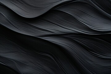 Abstract black fabric texture background with soft waves patterns