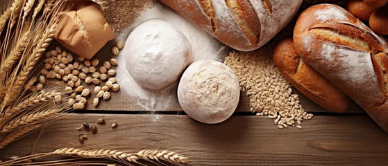 Fotobehang Assortiment de pain, blé, graine et farine sur du bois  © Maximilien