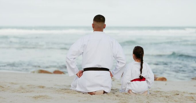 Karate, fitness and father at beach with girl child for training, wellness or learning rear view. Sports, martial arts and kid with sensei man on ocean sand for defense, workout or kung fu in nature