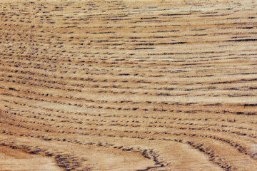 The texture of the treated wooden surface made of boards. Large wooden wall background