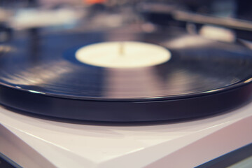 Turntable vinyl record player, close-up view, selective focus