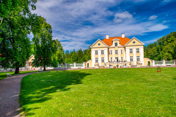 Fototapeta na wymiar Palmse, Estonia - July 14, 2017: Palmse Manor and surrounding meadows in summer season