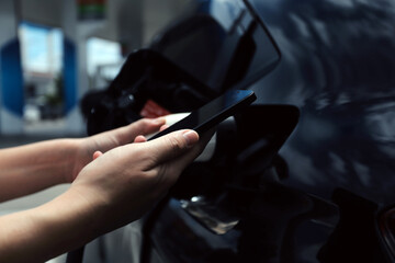 EV charging station for electric car in concept of green energy and eco power produced from sustainable source to supply to charger station in order to reduce CO2 emission . - obrazy, fototapety, plakaty