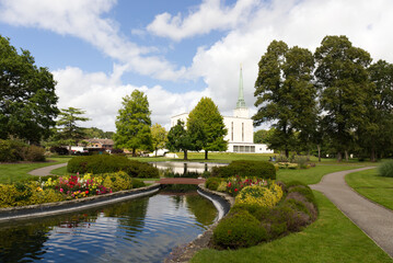 LDS temple in London park view, trees and lake