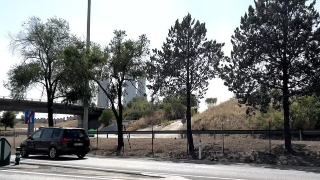 Traveling from a car with views of the emblematic towers of Madrid, seen from the well-known M30 highway