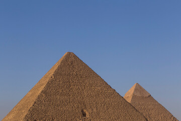 Fototapeta na wymiar Great pyramid and pyramid of Khafre in Giza against clear blue sky