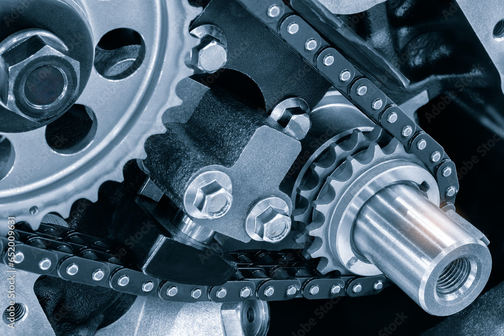 Aufkleber new car timing chain on a disassembled engine in a car workshop. Timing chain in internal combustion engine