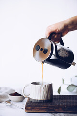 Obraz premium Brewing coffee with a French press