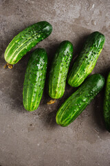 Fresh cucumbers on dark background.