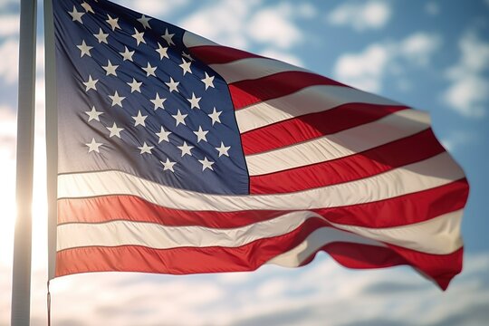 A powerful image of a large American flag fluttering in the wind. Perfect for patriotic themes and celebrations.
