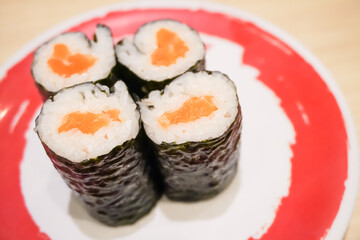 Various sushi platter in square ceramic plate on Japanese Restaurant. Concept for whole healthy food, nutrition, omega-3, animal protein, seafood, modern resto and street food. 