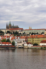 Fototapeta premium Prague - Prague Castle and Parliament are seen in the distance. Taken from across the main river from Charles Bridge (1357)