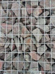 metal mesh filled with stones in landscape design