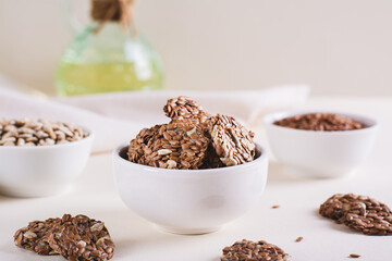 Crispy baked bread from flax and sunflower seeds in a bowl on the table