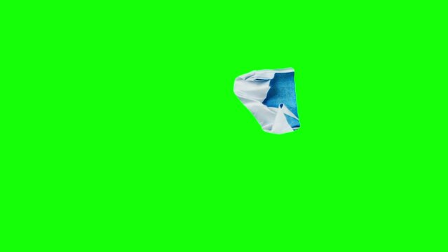 Initial letter K on crumpling blue page filmed in stop motion against green screen background. Loop isolated footage of capital alphabet symbol printed on unwrapping paper on chroma key. Brand ads