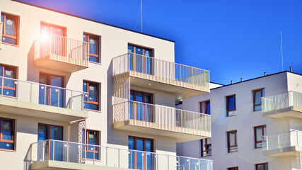 Modern luxury residential building. Modern apartment building on a sunny day. Facade apartment building  with a blue sky.  - obrazy, fototapety, plakaty