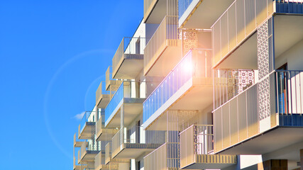 Modern luxury residential building. Modern apartment building on a sunny day. Facade apartment building  with a blue sky. 