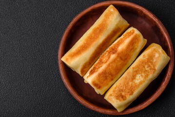 Delicious fresh homemade fried pancakes with broccoli and meat or fish