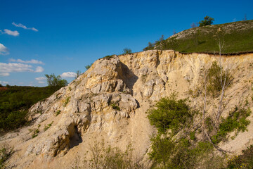 Fototapeta na wymiar Wall of a hill near Gant, near a bauxite mine