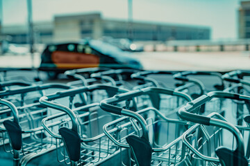 Airport carts and taxi in the background