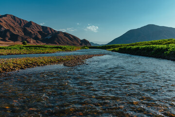 Picturesque mountain landscape with shallow river