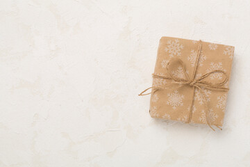 Craft christmas gift boxes on concrete background, top view