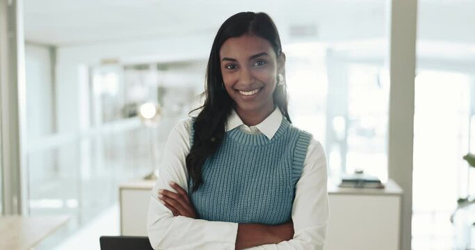 Business woman, arms crossed and face of a corporate worker in a office ready for compliance officer job. Female professional, smile and portrait with confidence and pride at workplace