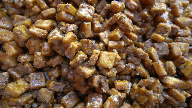 Sweet kotkoti, a popular Filipino and Indian dessert. Kotkoti is a type of rice cake made with coconut milk and brown sugar. It is typically steamed and served with grated coconut.