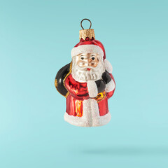 Christmas card. Falling in the air Christmas figurine.