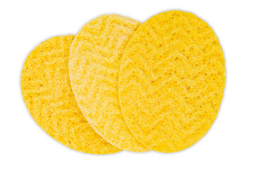 Three oval yellow sponges for cleaning face or cleaning surface texture isolated on white background