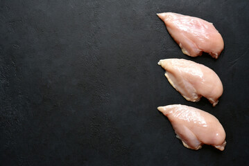 Raw chicken fillet with ingredients for making . Top view with copy space.