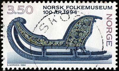 Beautiful carved sleigh on norwegian postage stamp
