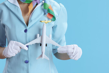 Closeup on female stewardess on blue