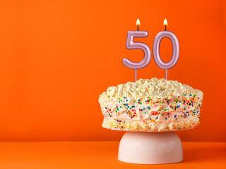 Birthday card with candle number 50 - Vanilla cake in orange background - obrazy, fototapety, plakaty