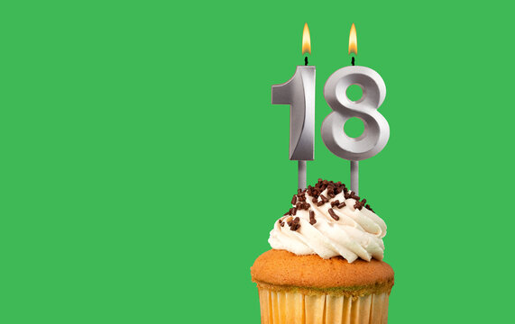 Birthday card with candle number 18 - Cupcake on green background